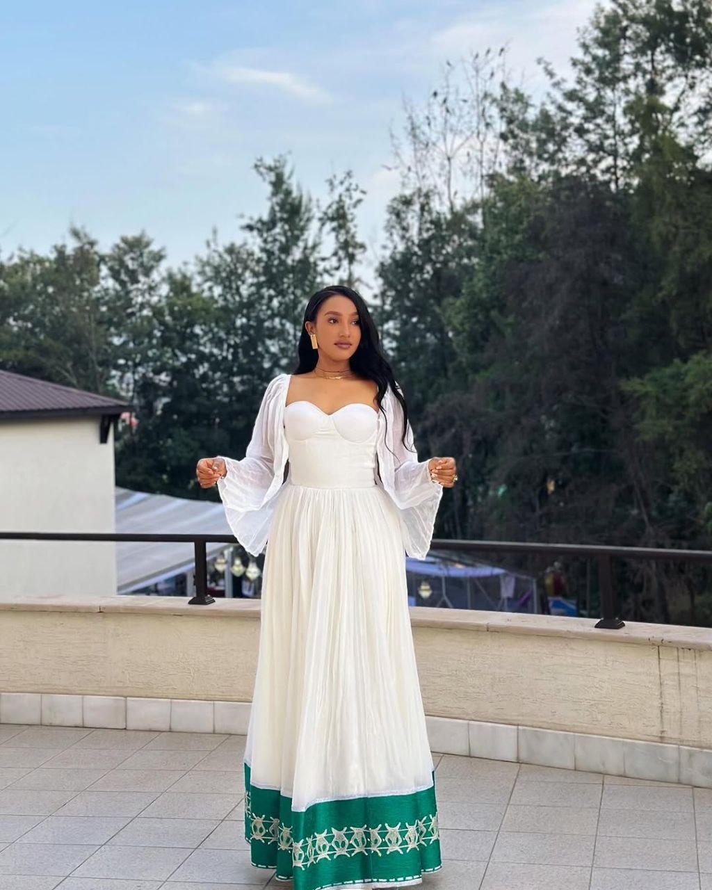 Radiant Habesha Dress with Elegant Green Embroidery a Beautiful Choice for an event