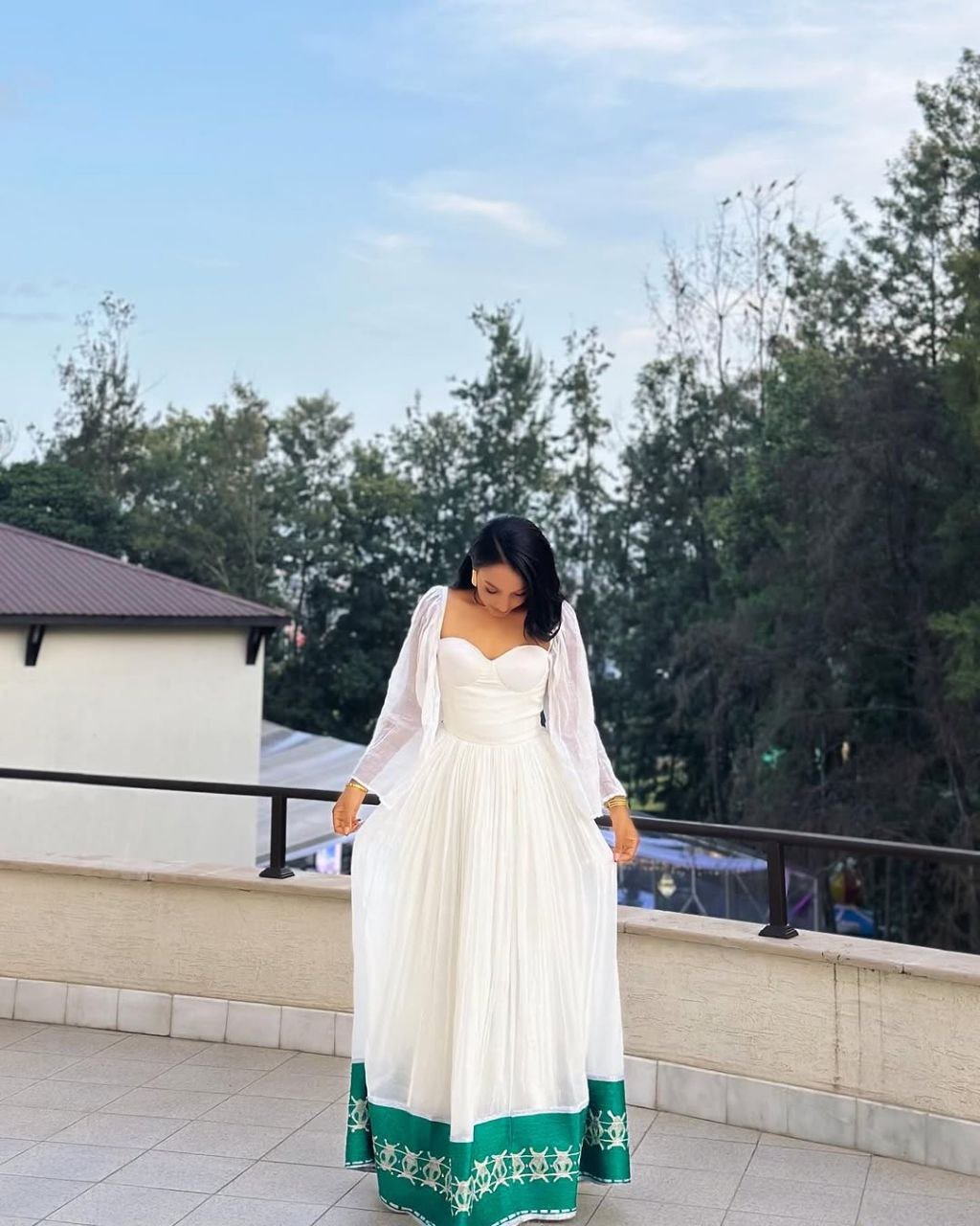 Radiant Habesha Dress with Elegant Green Embroidery a Beautiful Choice for an event