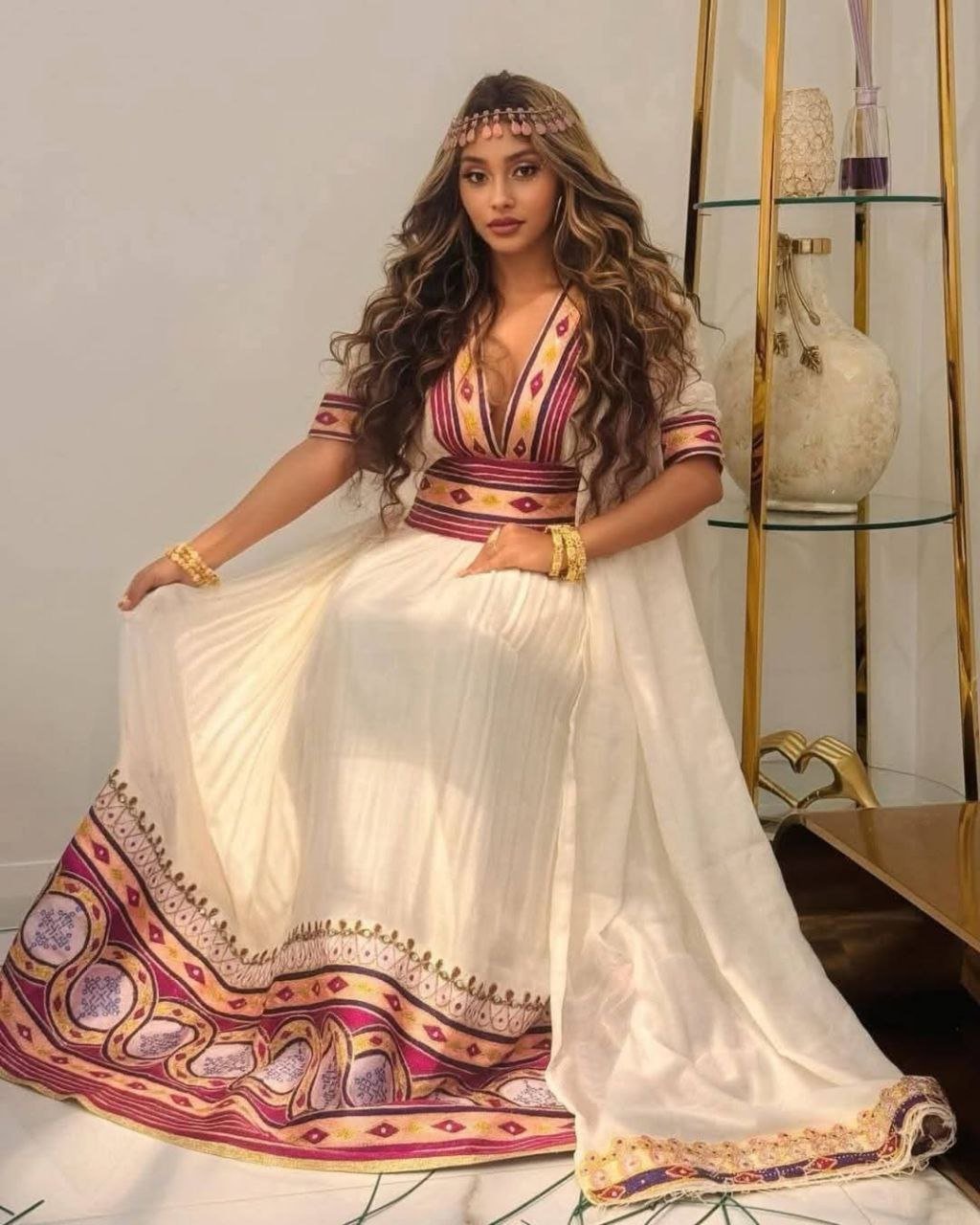 Stylish Habesha Dress with Intricate Purple and Gold Embroidery for an Event