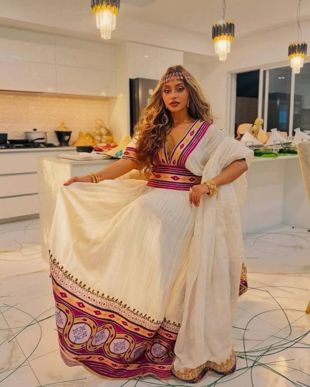 Stylish Habesha Dress with Intricate Purple and Gold Embroidery for an Event