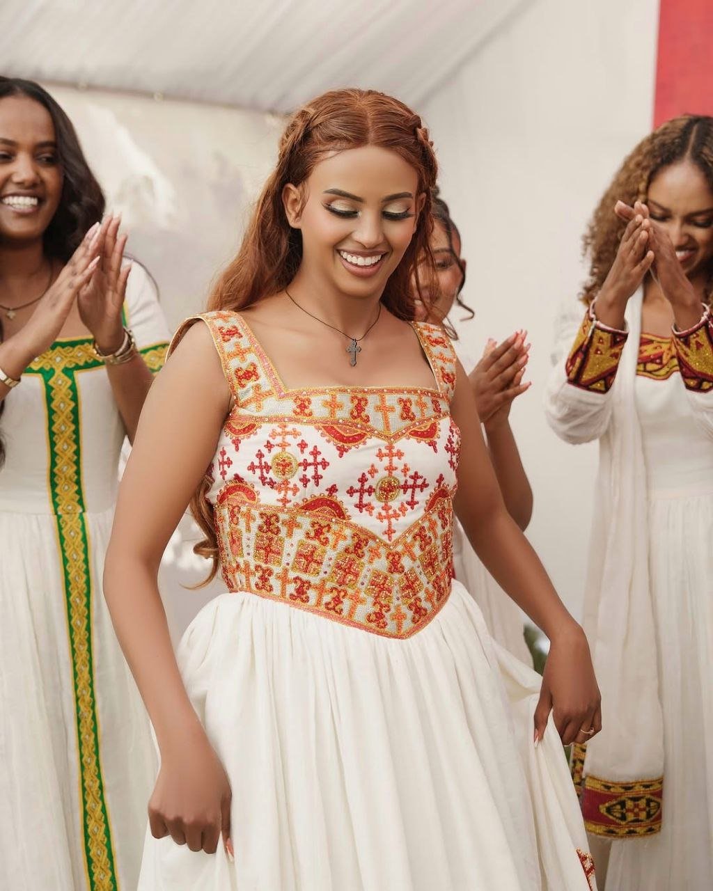 Elegant Habesha Kemis with Vibrant Red and Gold Embroidery for Your Wedding