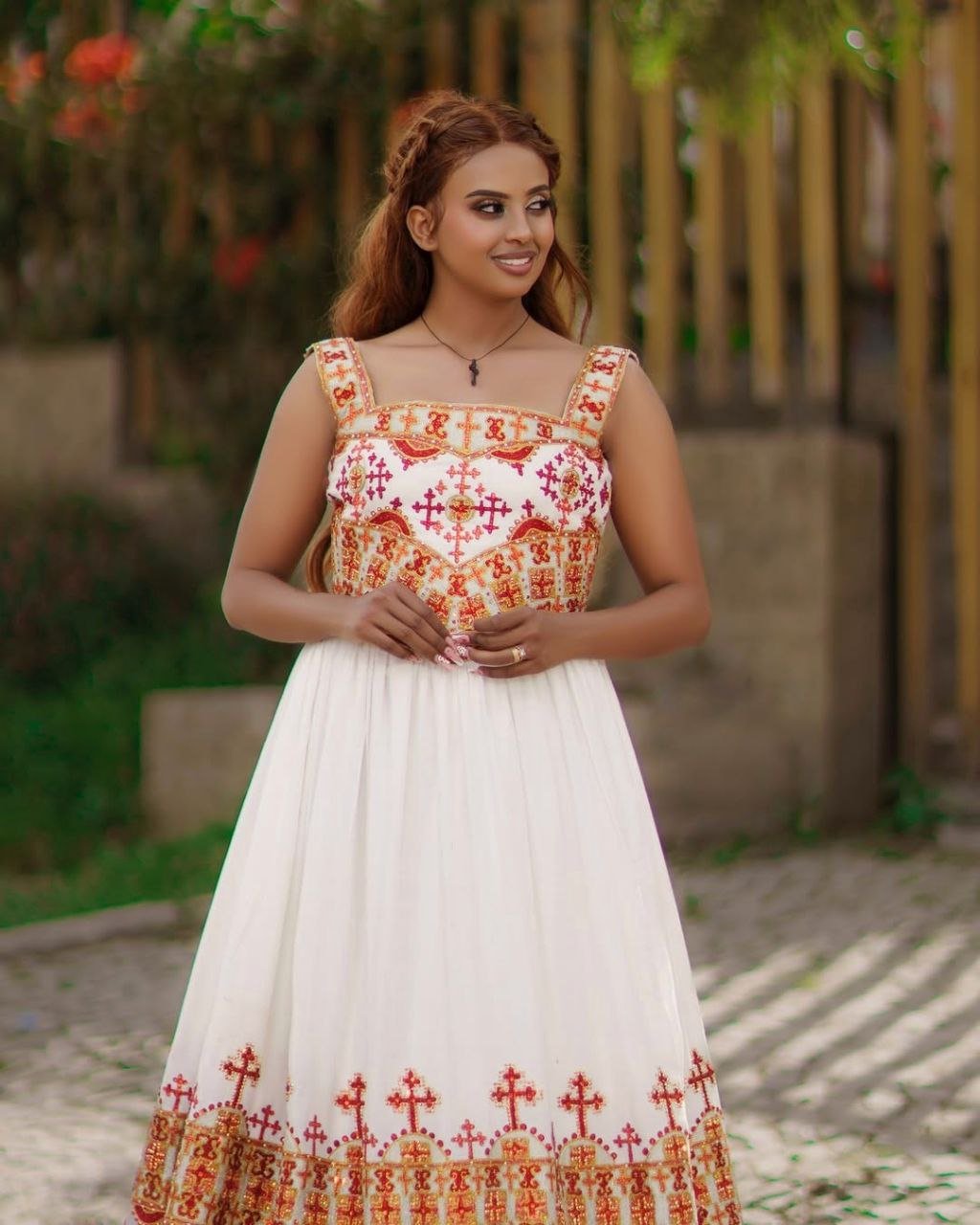 Elegant Habesha Kemis with Vibrant Red and Gold Embroidery for Your Wedding
