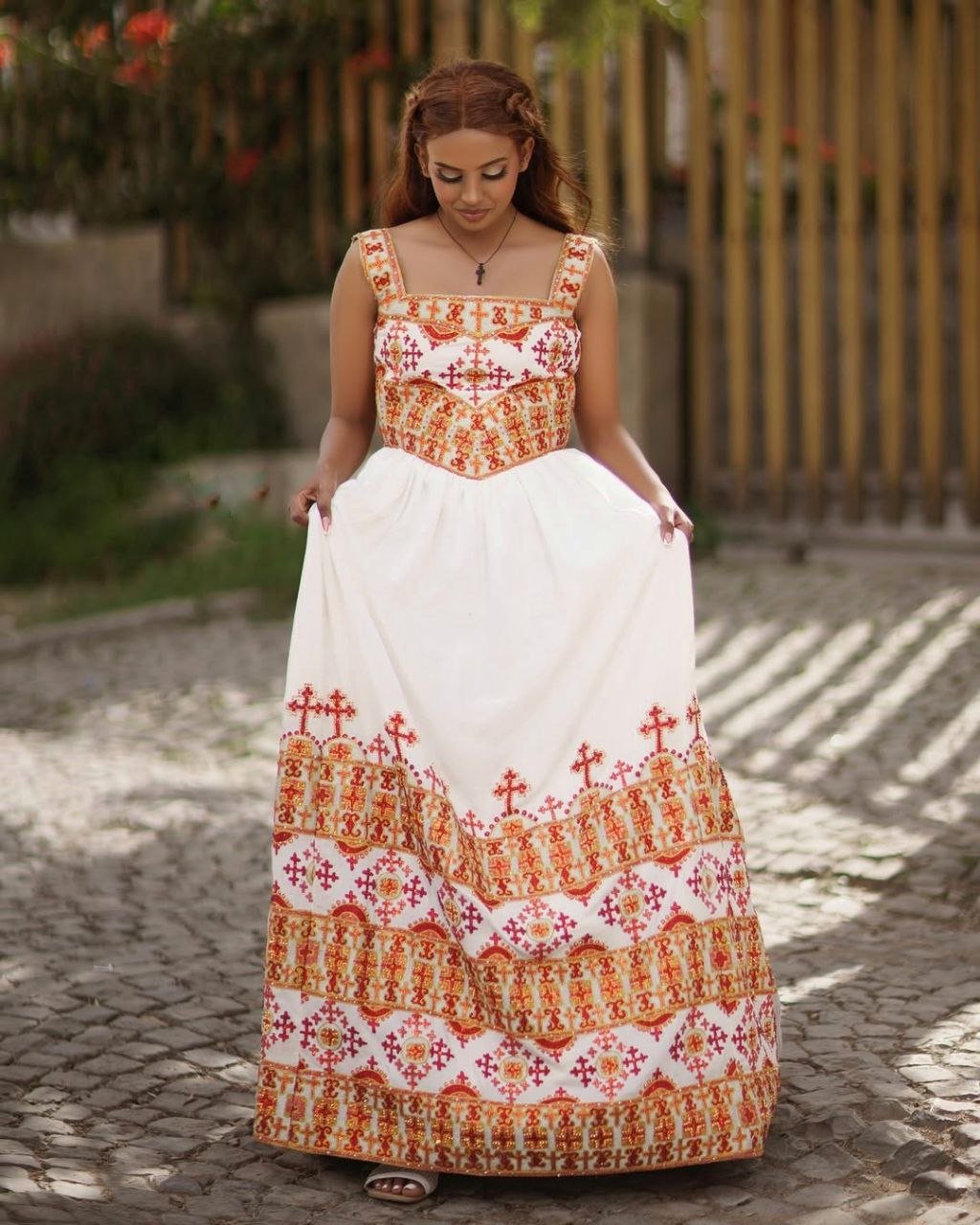 Elegant Habesha Kemis with Vibrant Red and Gold Embroidery for Your Wedding