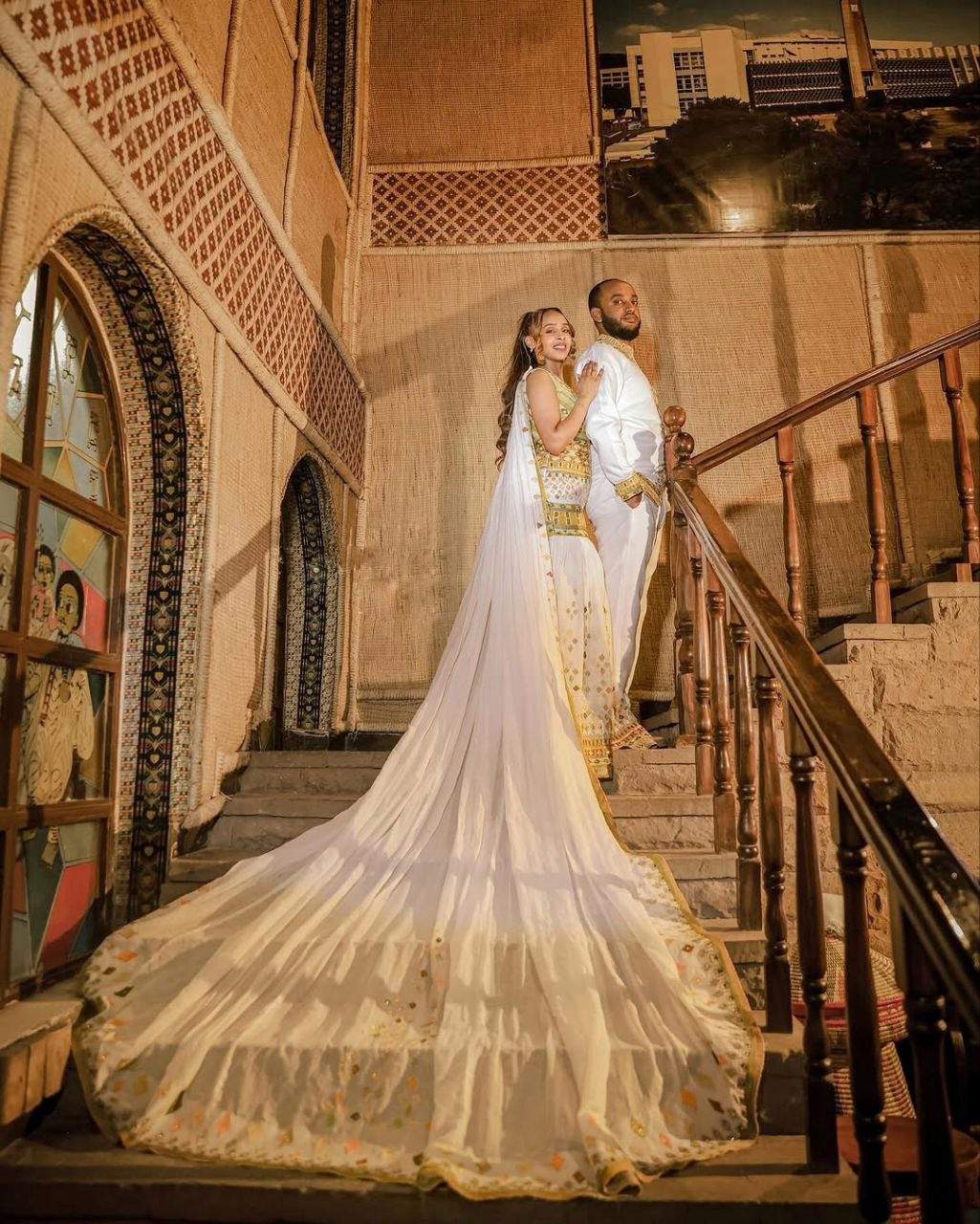 Regal Traditional Habesha Couples Attire with Flowing Veil for Wedding