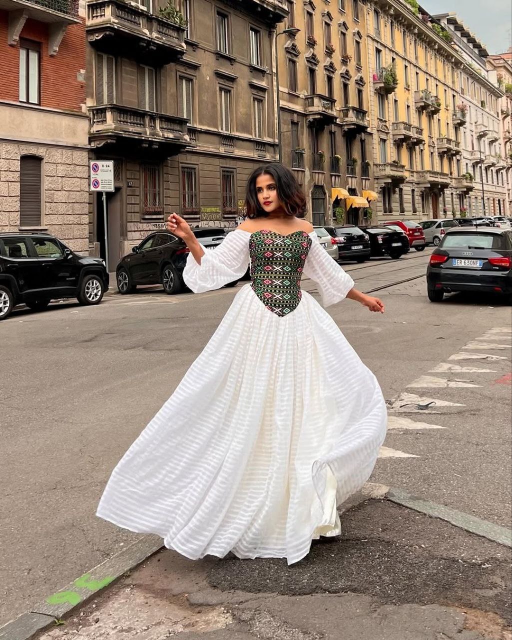 Vibrant Off-Shoulder Habesha Kemis Elegant Ethiopian Dress with Multi-Color Embroidered Bodice