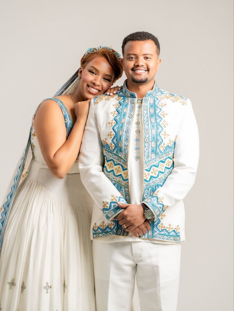 Beautiful Habesha Wedding Attire for Couples β Cultural Ethiopian Clothing with Blue & Gold Details