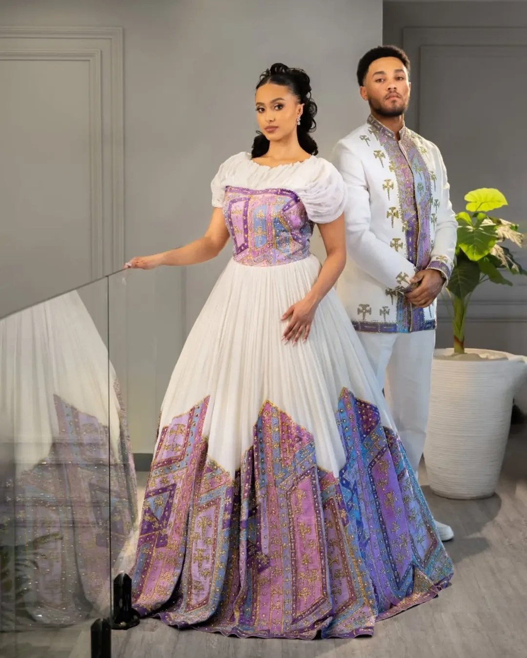 Royal Ethiopian Couple's Attire with Purple & Gold Cross Motifs