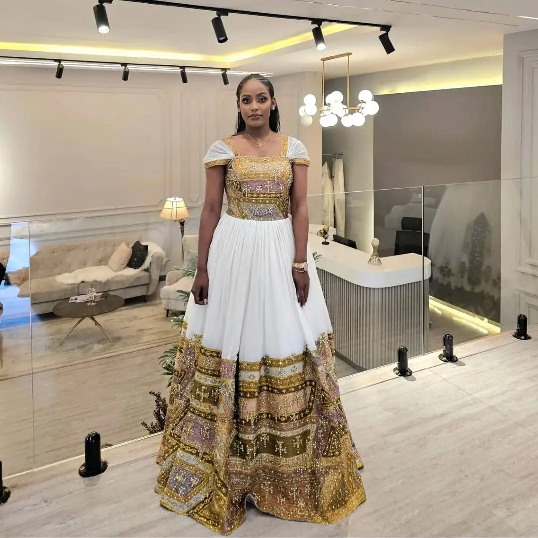 Shimmering Golden Habesha Dress: Beaded Cross Ornaments on Traditional Ethiopian Dress Gorgeous Ethiopian Wedding Dress