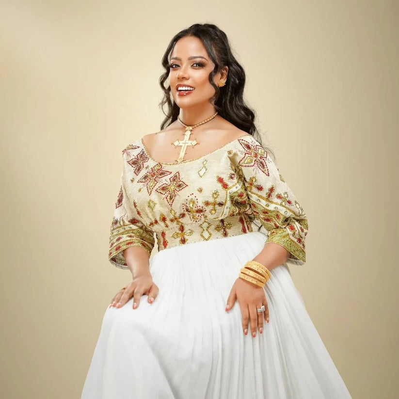Ethiopian Dress – Elegant White Cotton with Orange Embroidery for Evening Galas