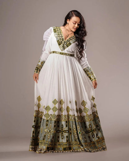 Classy Light Green Habesha Kemis with Golden Patterns