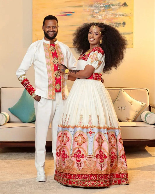 Elegant Habesha Couple's Attire with Vibrant Red and Gold Embroidery for Weddings