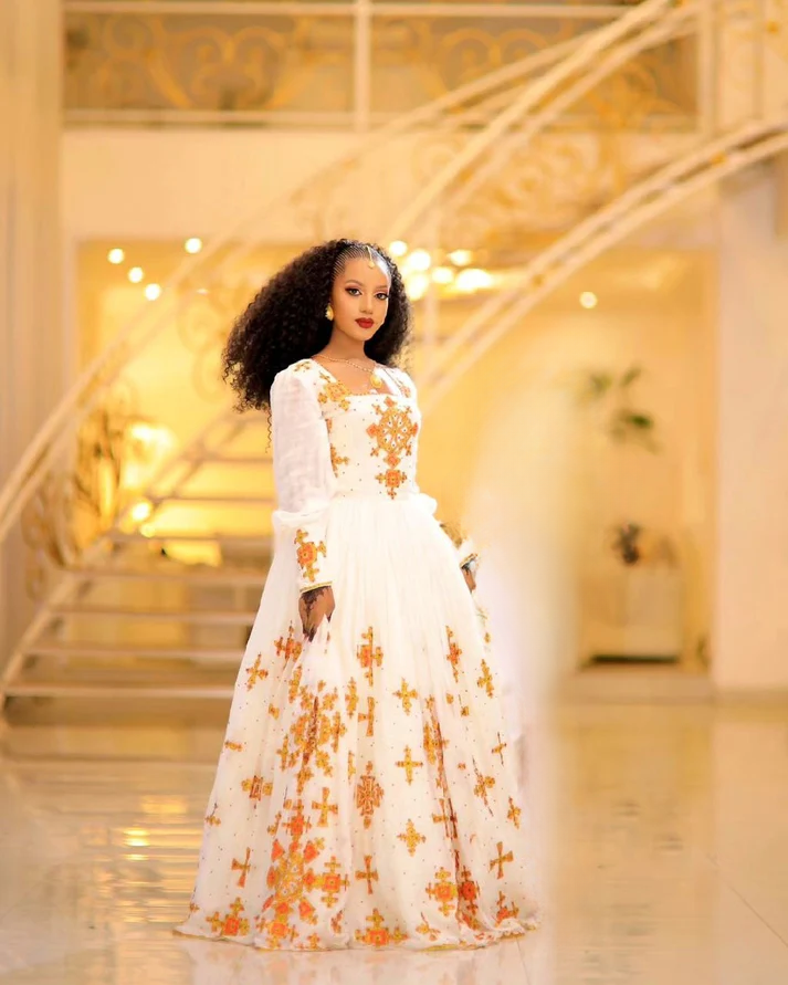Beautiful Golden Habesha Wedding Dress: Round Cross Design on Traditional Ethiopian Wedding Outfit