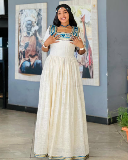 Chic Ethiopian Traditional Dress: White Habesha Kemis with Blue & Silver Accents