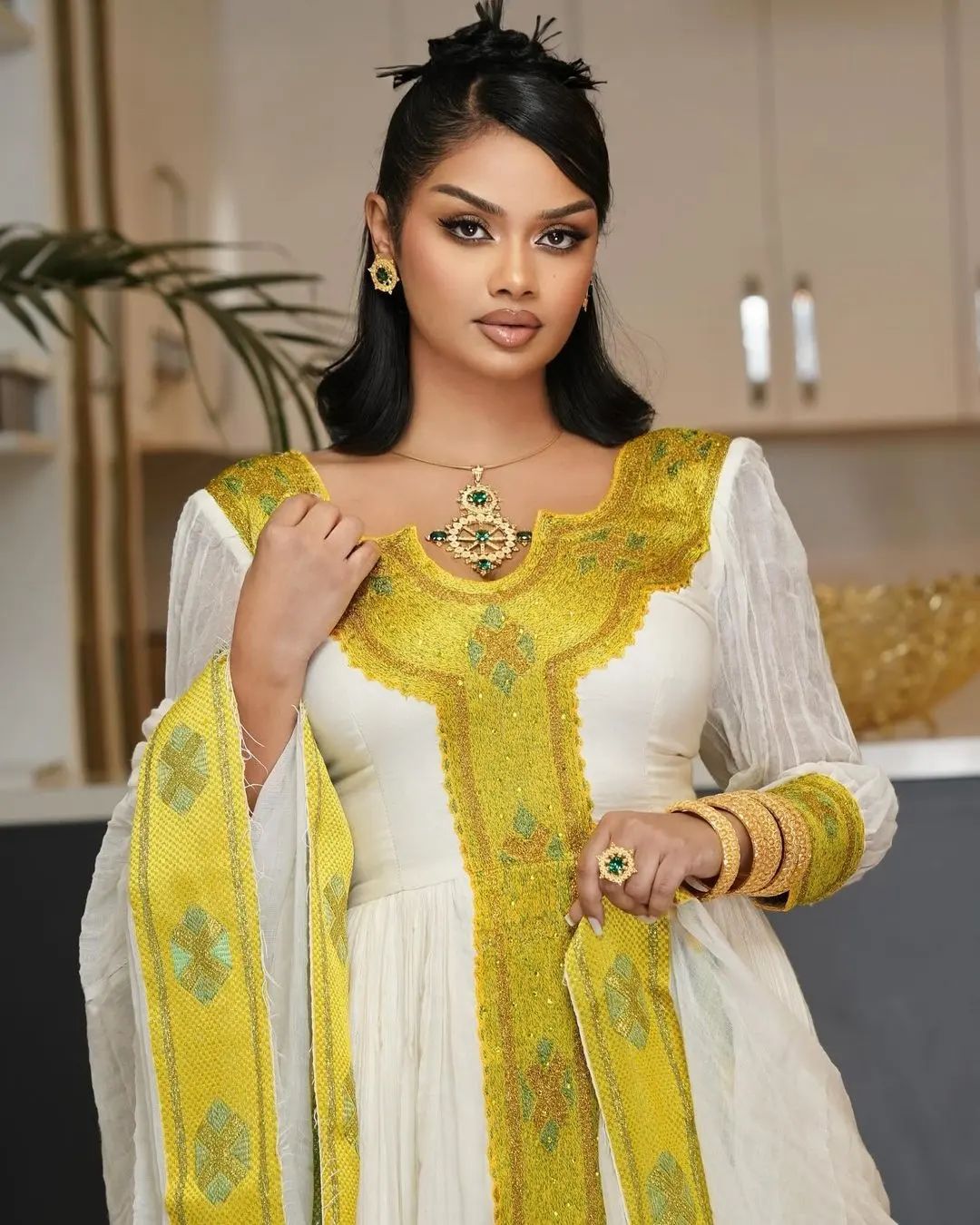 Golden yellow vibrant traditional dress with shimmering details Habesha ...