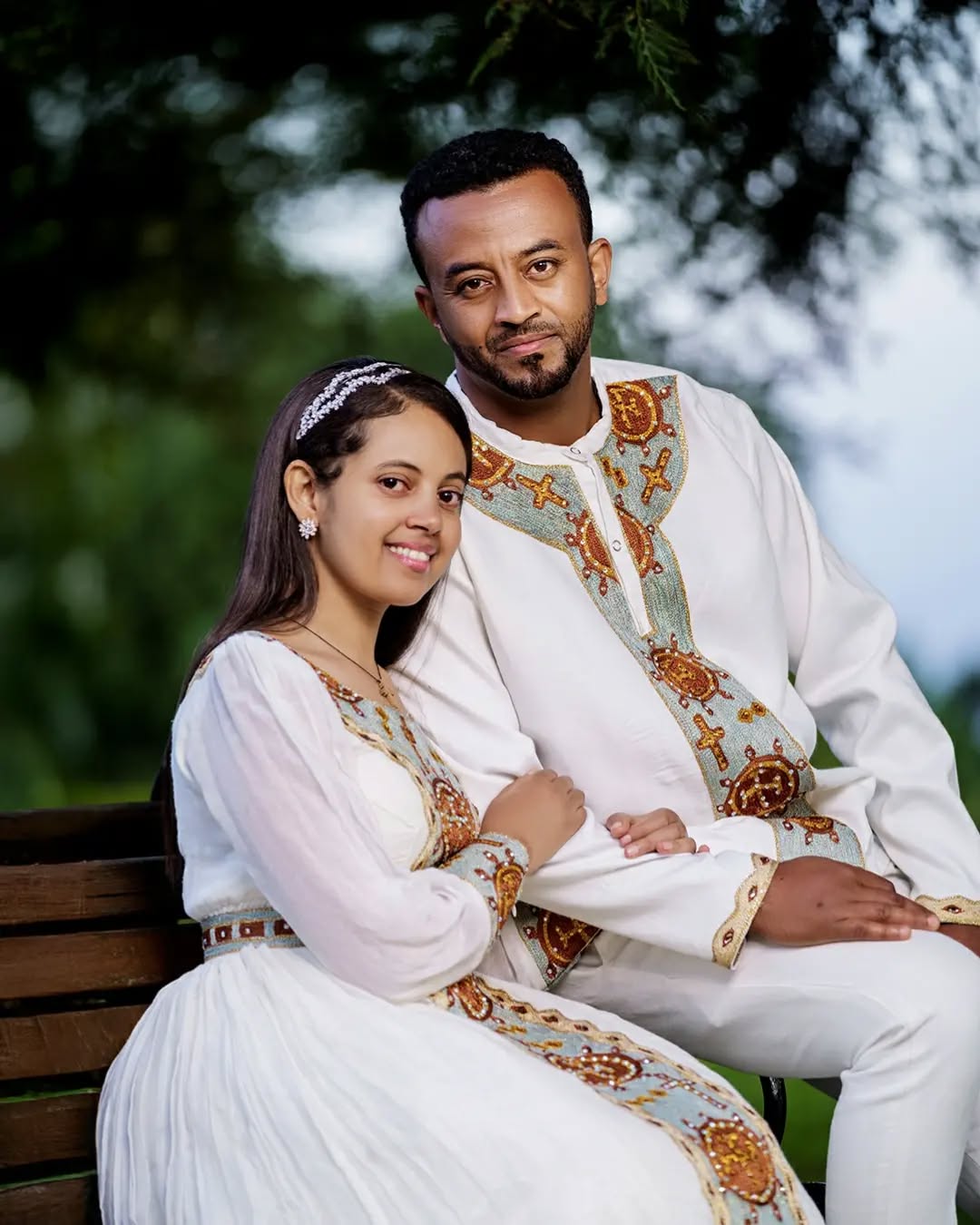 Fondling Love in Light Blue Habesha Couples Outfit Closeup
