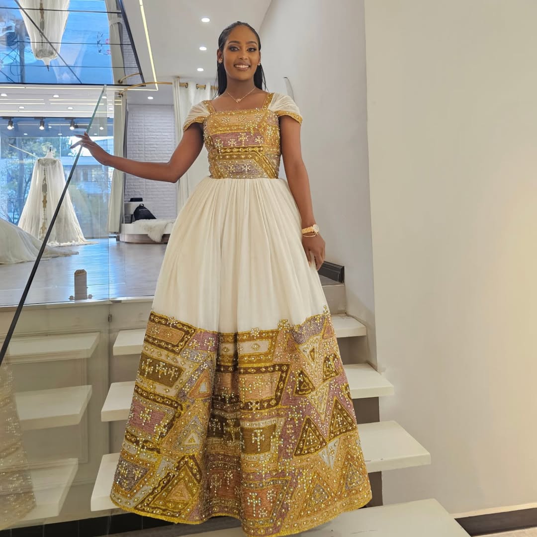 Shimmering Golden Habesha Dress: Beaded Cross Ornaments on Traditional Ethiopian Dress Gorgeous Ethiopian Wedding Dress