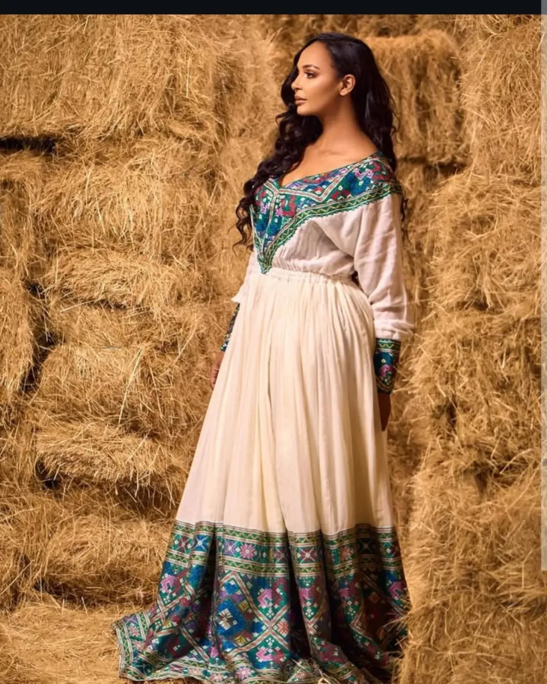 Regal Beauty with Blue Ethiopian Dress: Purple Detailing on Traditional Eritrean Dress Beautiful Colorful Habesha Dress