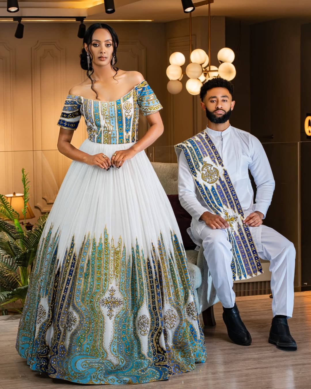 Vibrant Blue Habesha Couple's Attire with Intricate Detailed Design