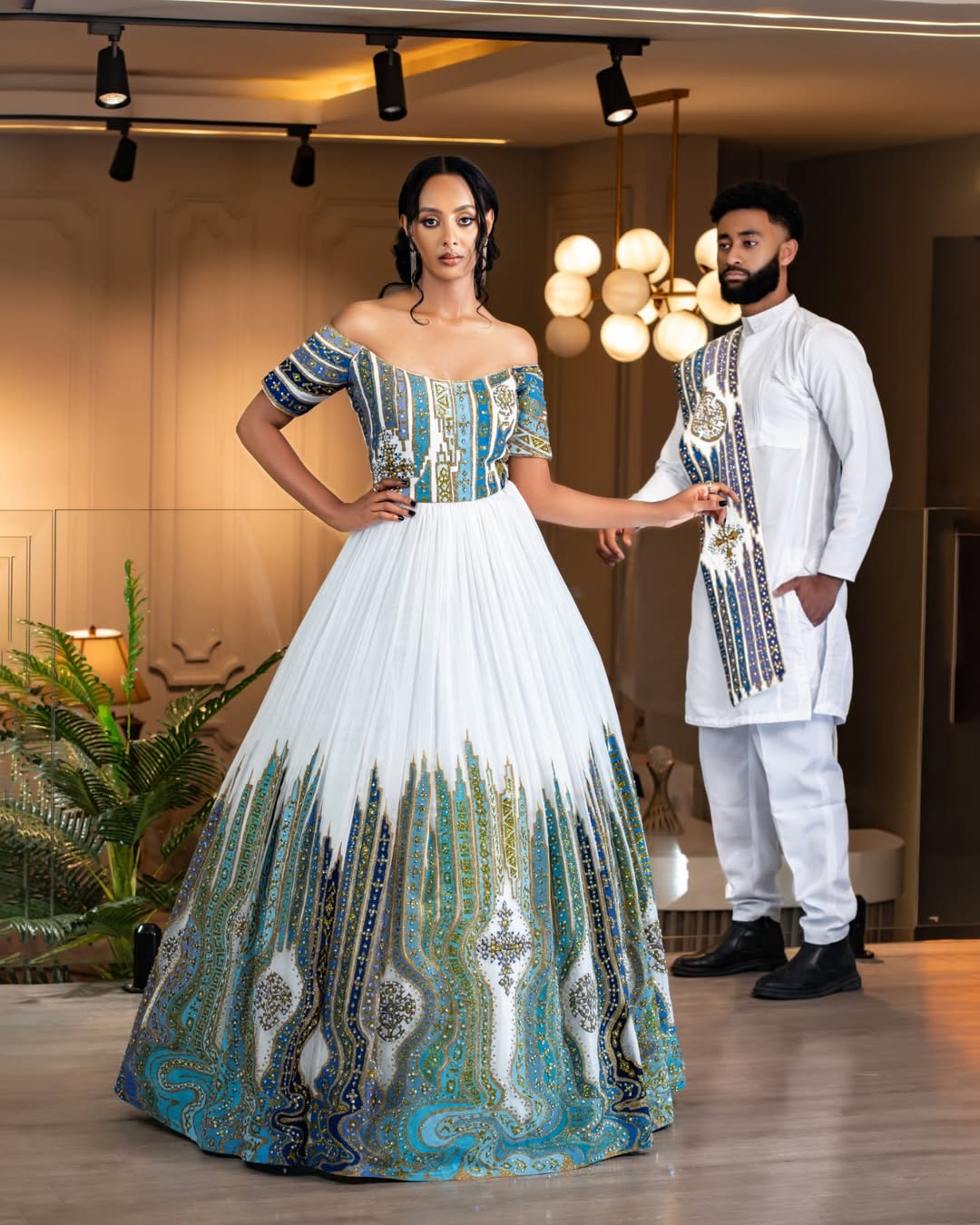 Vibrant Blue Habesha Couple's Attire with Intricate Detailed Design