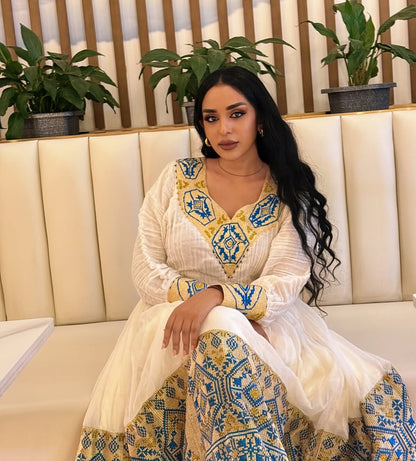 Stunning White Ethiopian Dress Adorned with Blue & Gold Motifs – Habesha Kemis