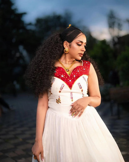 Elegant Habesha Dress with Vibrant Red and Gold Embroidery for Weddings
