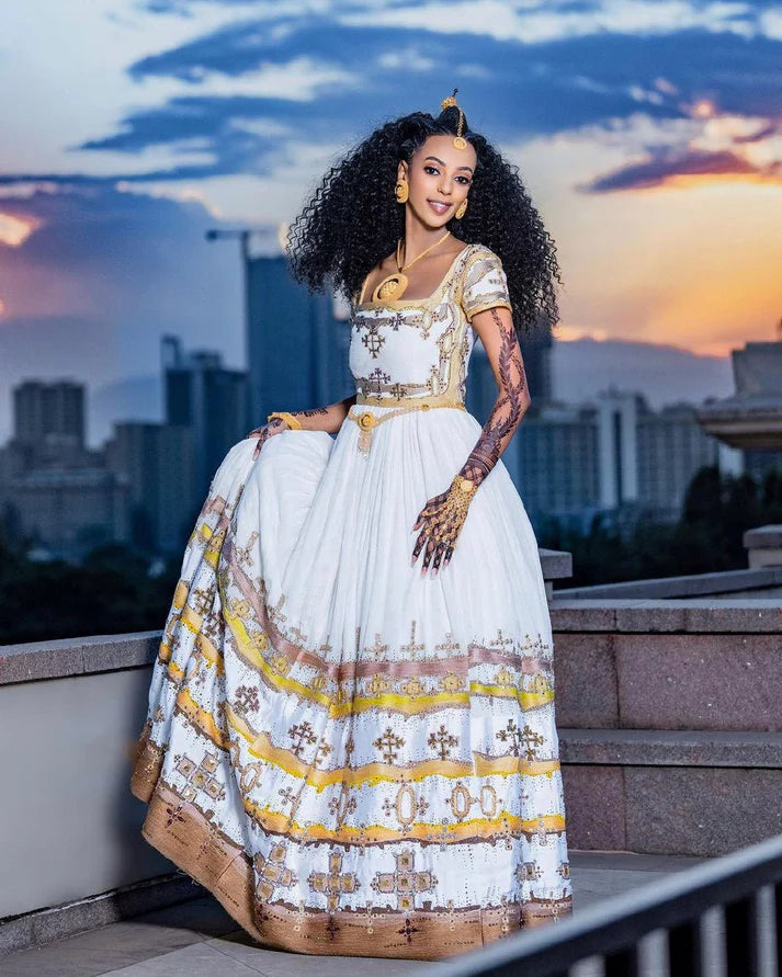 Sparkling Brown and Yellow Habesha Wedding Dress: Elegant Multiple Cross Patterns on Traditional Ethiopian Wedding Dress