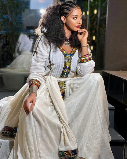 Vibrant Threads: Tilf Detailing in Menen Fabric Habesha Dress