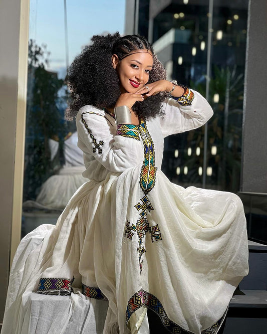 Vibrant Threads: Tilf Detailing in Menen Fabric Habesha Dress