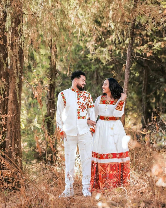 Elegant Habesha Wedding Couple’s Outfit with Rich Red and Gold Embroidery for Your Special Day
