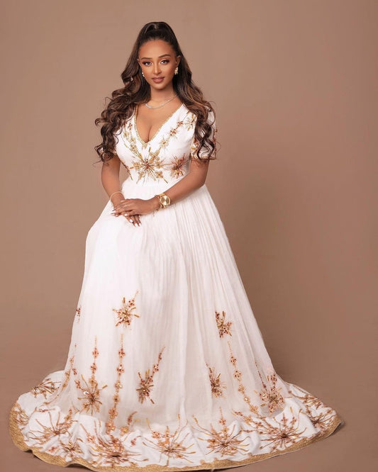 A Habesha Dress of Menen Fabric, Shimena Bottom, and White and Golden Tilf Design with Beadwork, Habesha Kemis, Eritrean dress, ሀበሻ