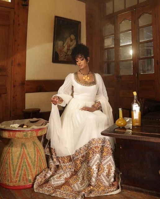 A Shimmering Modern Habesha Kemis with Full Shimena and Tilf