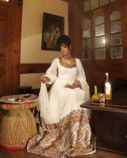 A Shimmering Modern Habesha Kemis with Full Shimena and Tilf
