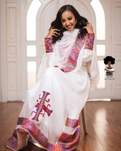 Artistic Elegance: Handwoven Vibrant Habesha Dress in Warm Colors