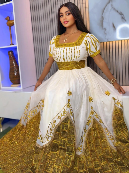 Elegant Habesha Kemis – Golden Embroidered Traditional Ethiopian Dress