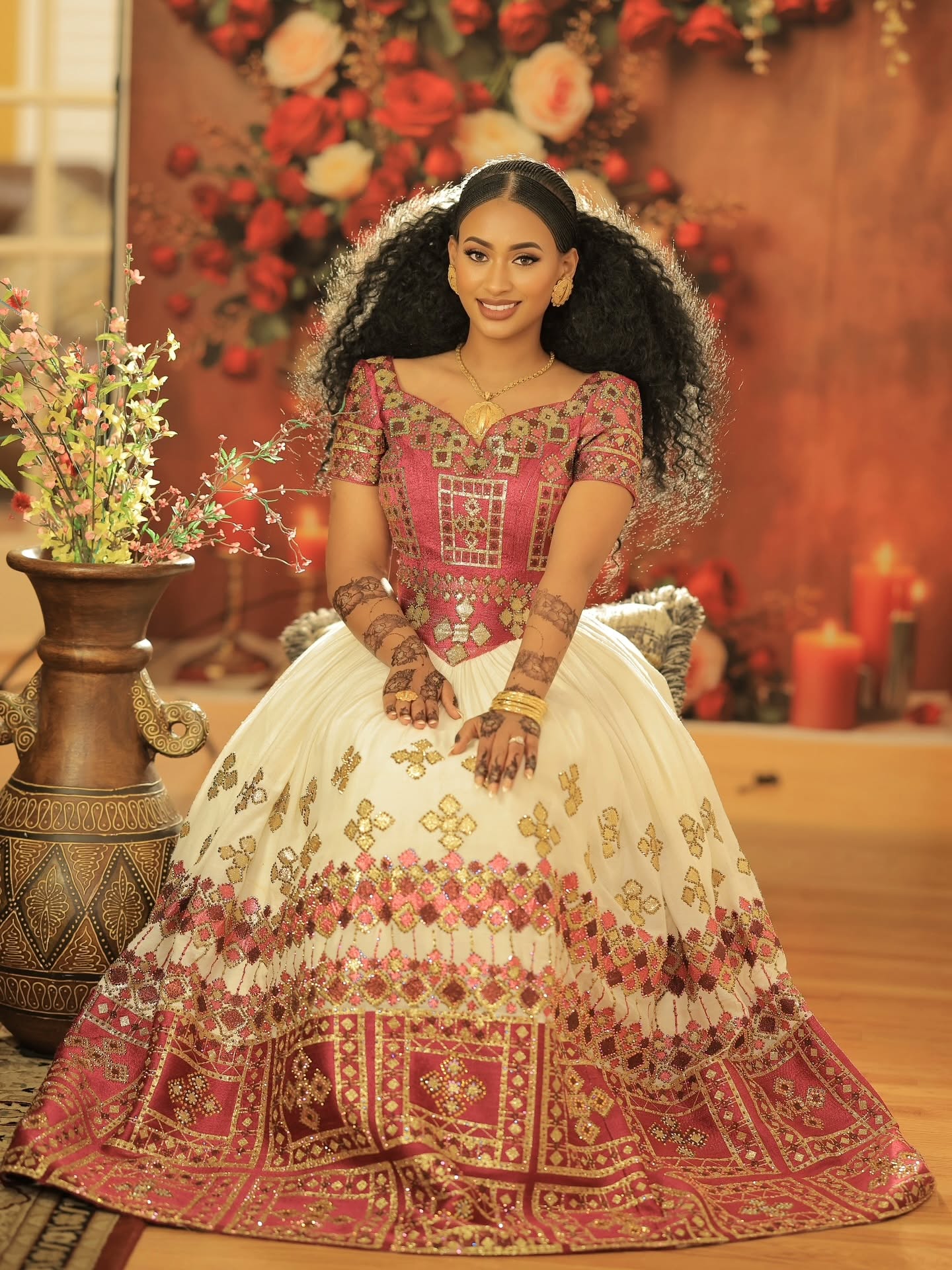  red and gold embroidered traditional ethiopian wedding dress
