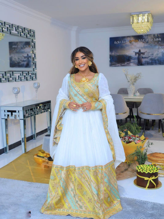 elegant white and gold embroidered traditional ethiopian wedding dress