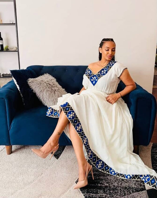 stylish ethiopian dress with blue embroidery on habesha cloth