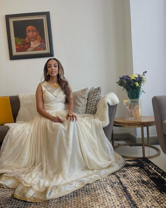 White Sleeveless Habesha Kemis with Gold Embroidery