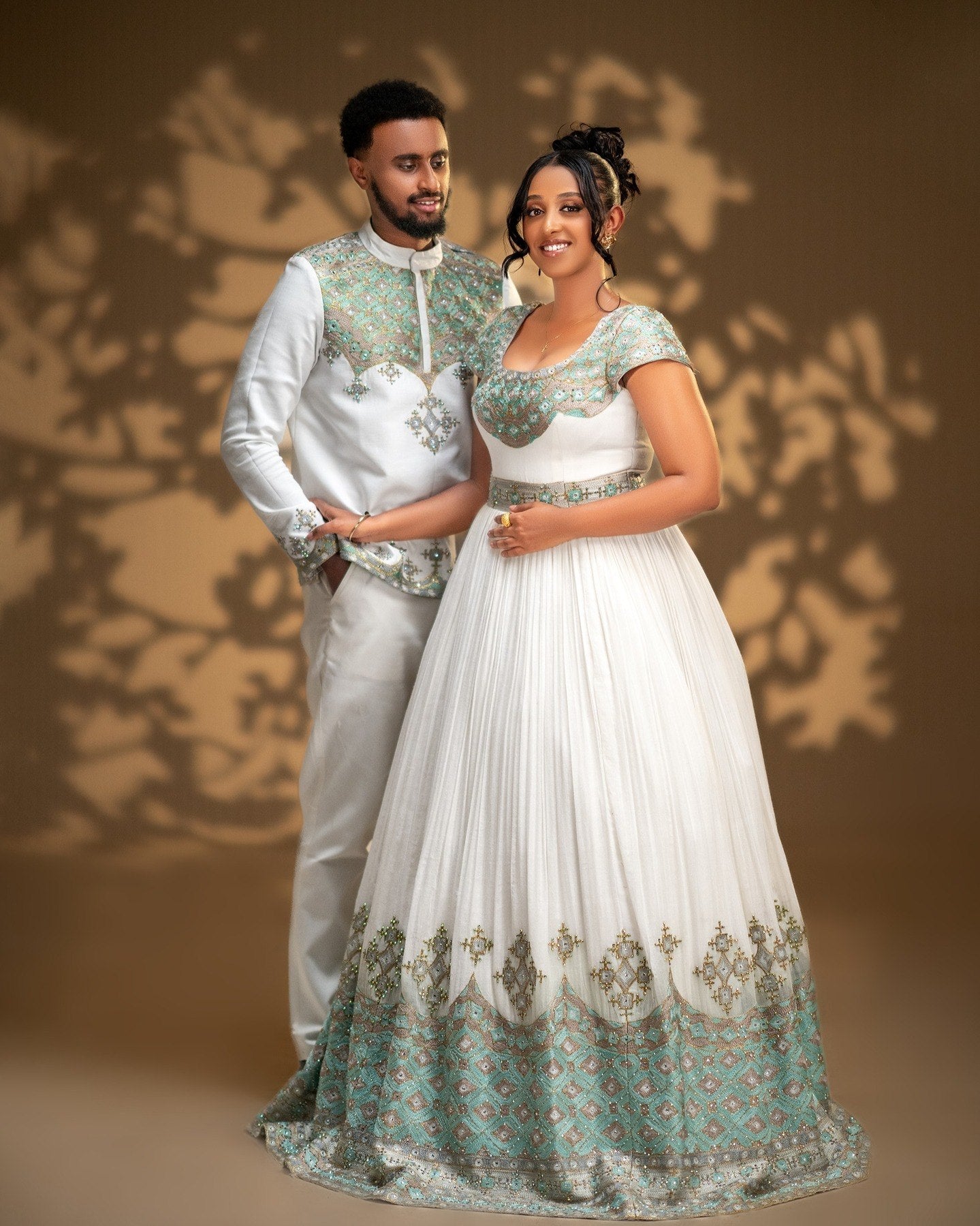 Elegant Habesha Couple Outfit with Mint Green Embroidery