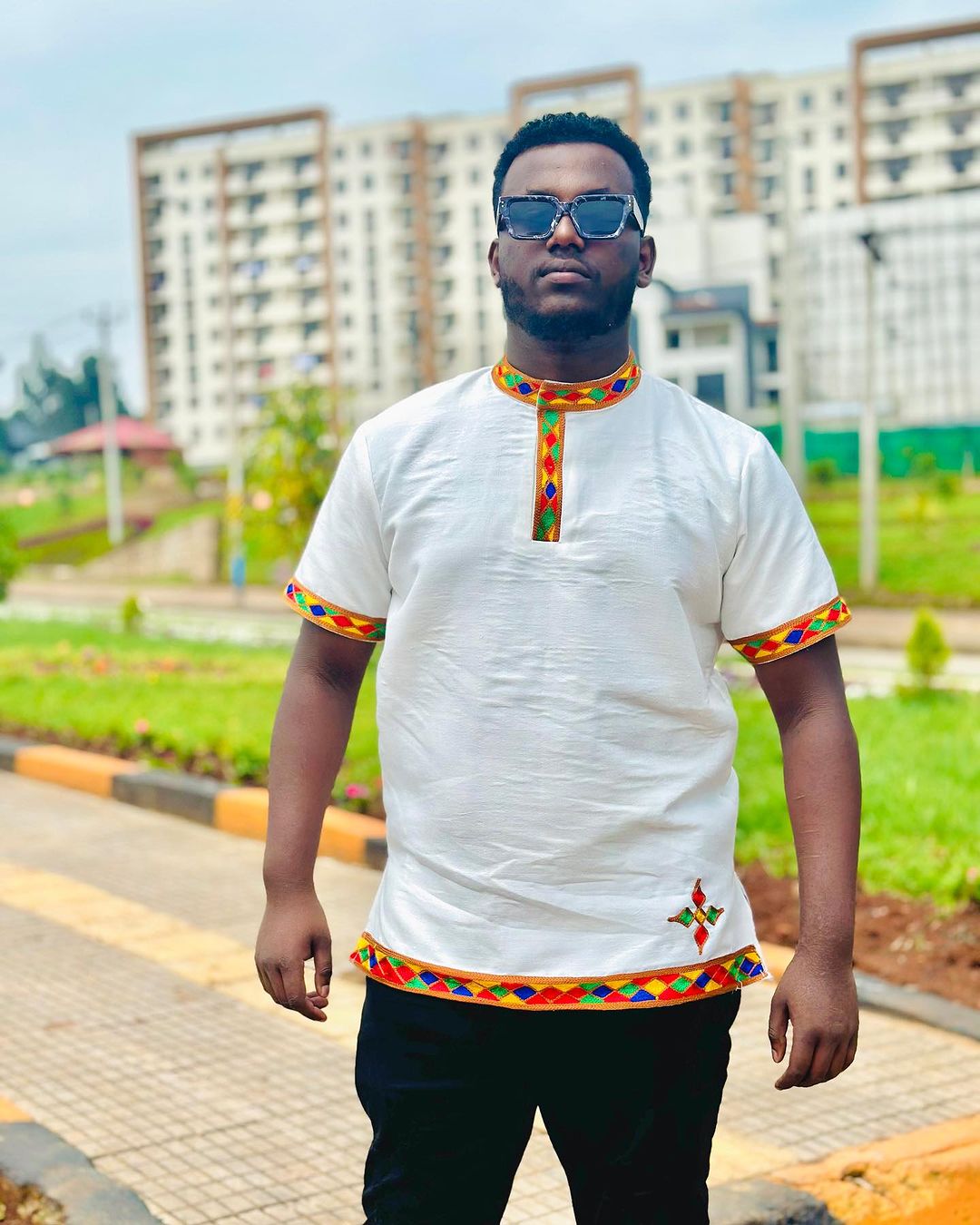 Vibrant Heritage: Handwoven Colorful Pattern Habesha Men's Shirt - A Kaleidoscope of Ethiopian Style