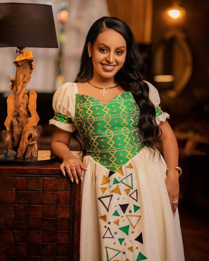 Contemporary Elegance: Habesha Wedding Attire with Modern Green Designs for Ethiopian Couples