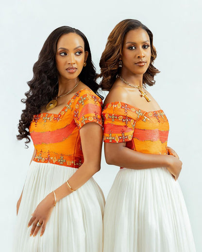 Radiant Elegance: Embrace the Splendor of Habesha Kemis - Vibrant Orange Ethiopian Dress