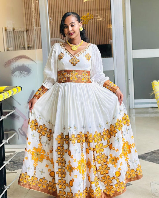 Beautiful Golden Habesha Kemis with Intricate Embroidery