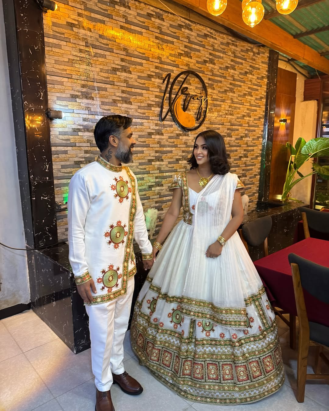 Multicolor Masterpiece: New Design Habesha Wedding Dress with Intricate Embroidery