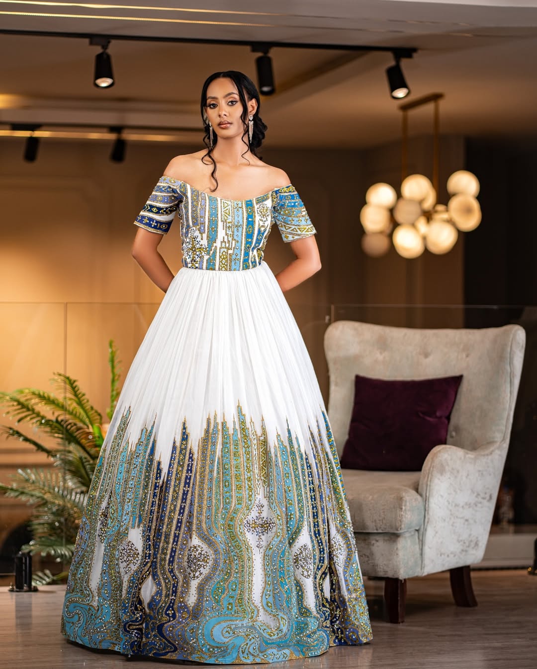 Modern Off-Shoulder Habesha Wedding Dress with Artistic Detailing