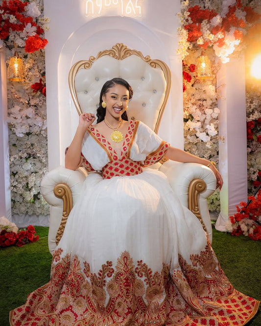  A Bride’s Bold Elegance: Radiant Red Habesha Dress with Golden Embroidery Glow
