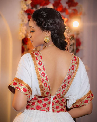 Modern Habesha Wedding Dress: Glowing in Radiant Red and Golden Embroidery