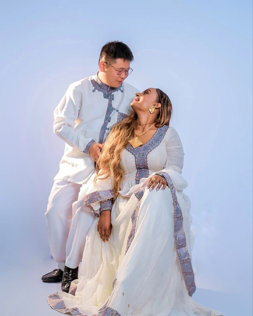 Elegant Habesha Couple Outfit with Soft Lavender Embroidery for Ethiopian Weddings