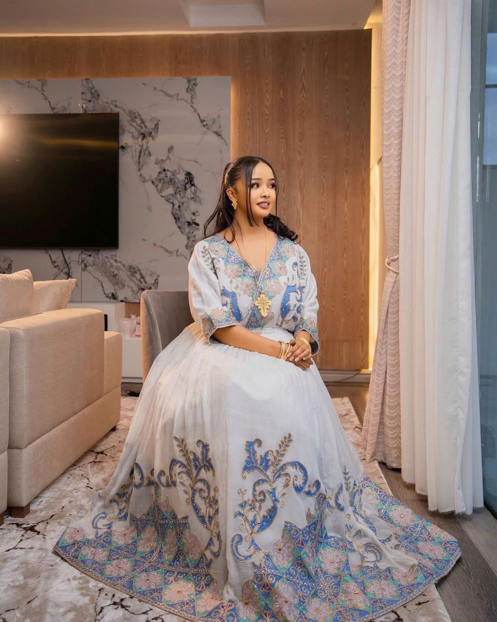 Graceful Habesha Kemis with Pastel Blue and Gold Embroidery for Engagements and Celebrations

