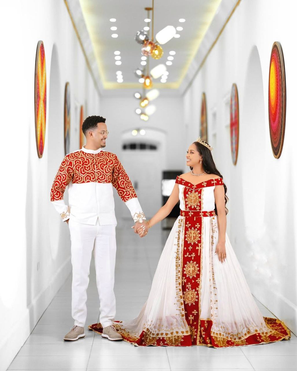 Bold Red and Gold Habesha Couple Outfit with Royal Embroidery for Weddings and Celebrations